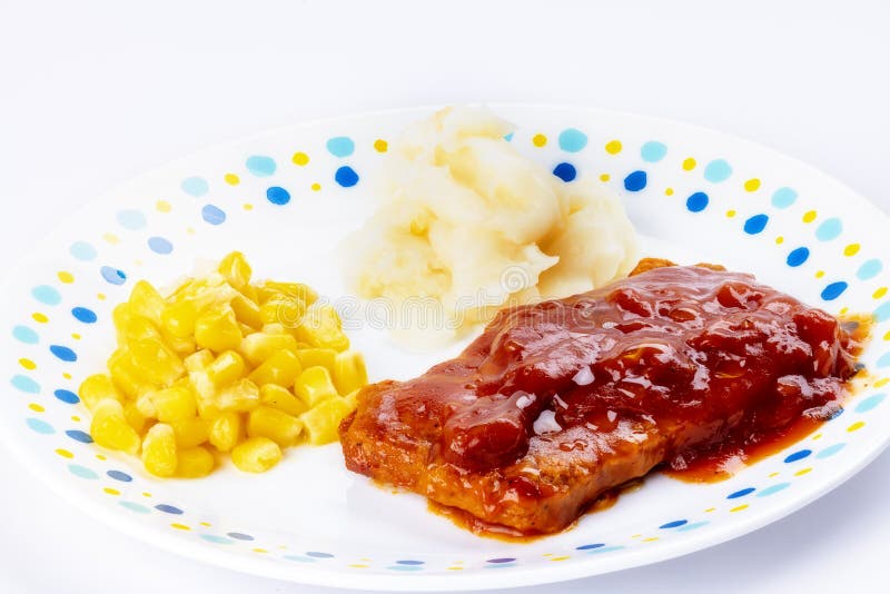 Rib Meat TV Dinner Served on a Plate with Corn and Potatoes Stock Photo