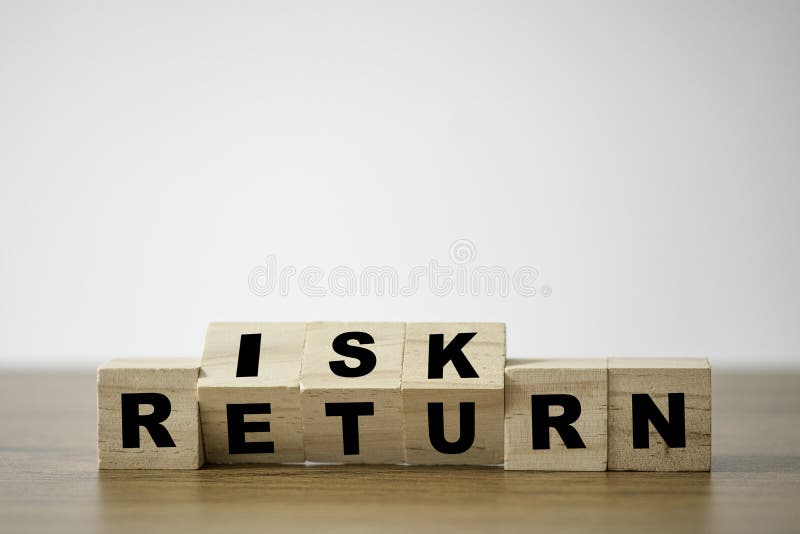 Flipping of wooden cubes block which print screen risk and return wording. Investment concept about balance between risk and return. Flipping of wooden cubes block which print screen risk and return wording. Investment concept about balance between risk and return.