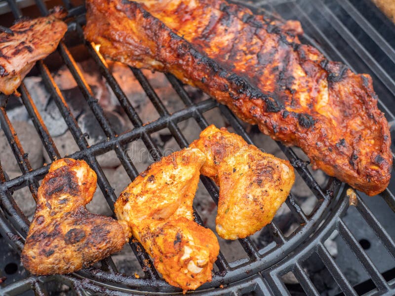 Ribs and Chicken Wings on the Charcoal Grill Stock Image Image of