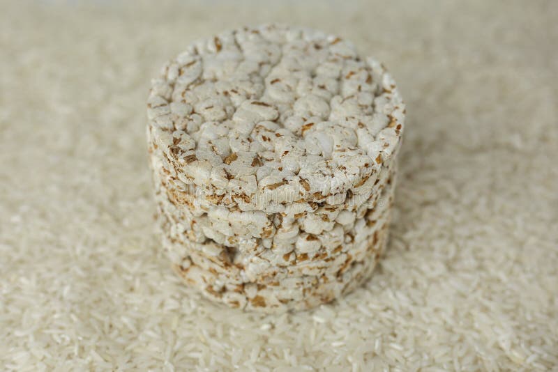 Rice Buckwheat Cake on a Background of Strewn Rice Groats Stock Image
