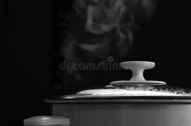 Rice cooking steam black and white background hot equipment kitchen food closed up image morning light Asia meal stock photo