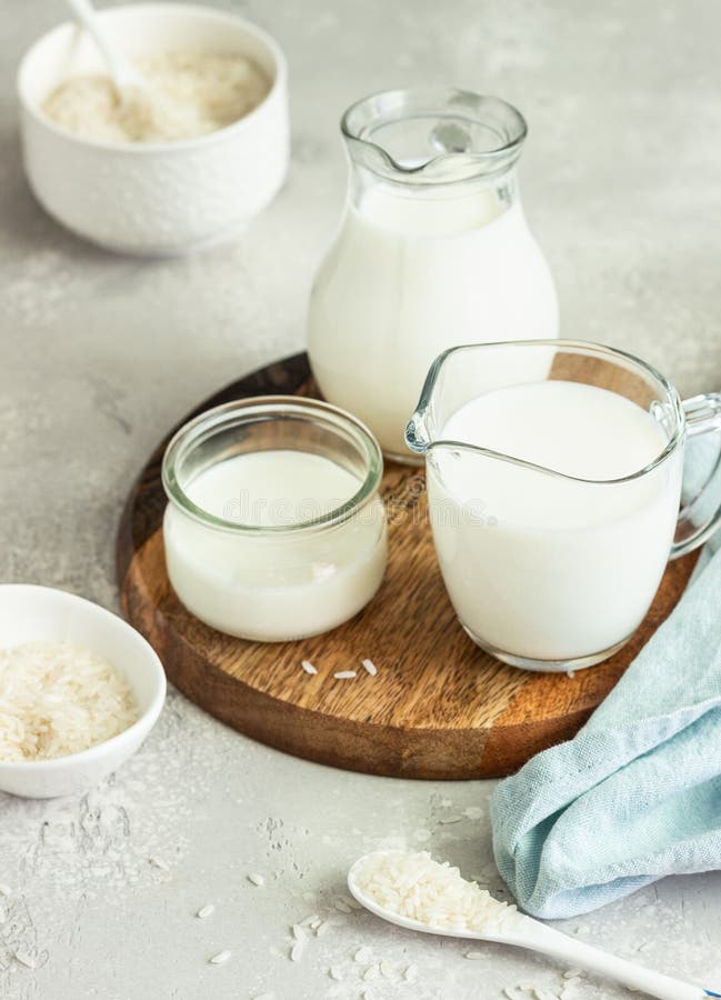 Rice Milk In Glass And Organic Rice On Wooden Background, Alternative ...