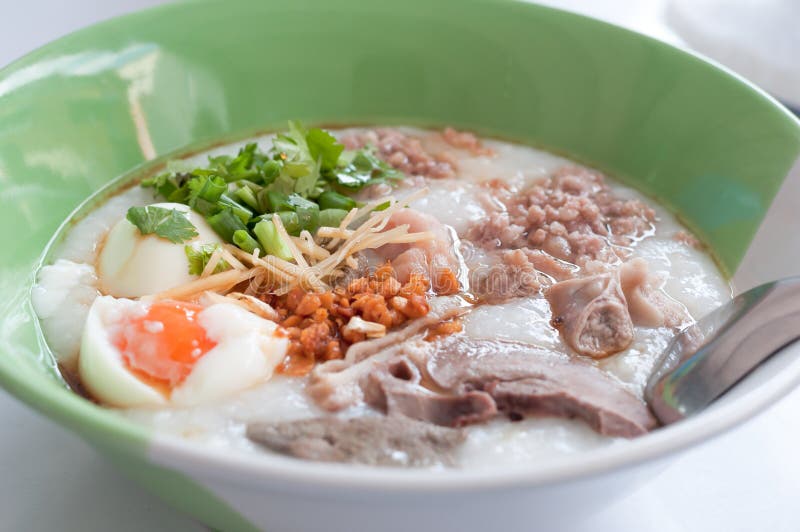 Rice porridge, rice gruel, congee rice soup with egg and pork stock images Rice porridge, rice gruel, congee rice soup with egg and pork stock images