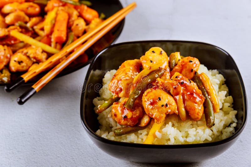 Rice with Stir Fry Chicken and Vegetable on Black Square Plate. Chinese