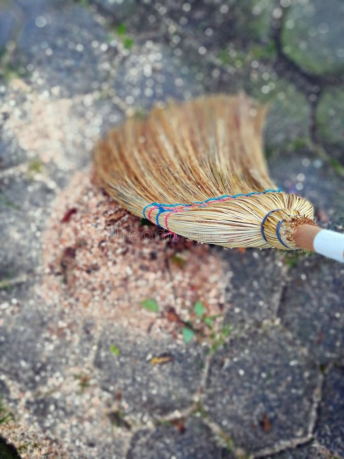 Rice straw broom in action stock photo. Image of ridge 99456766