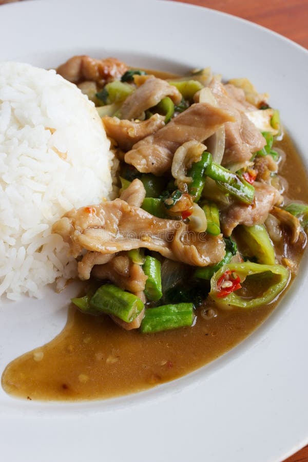 Rice Topped with Fried Pork and Basil. Stock Image Image of table