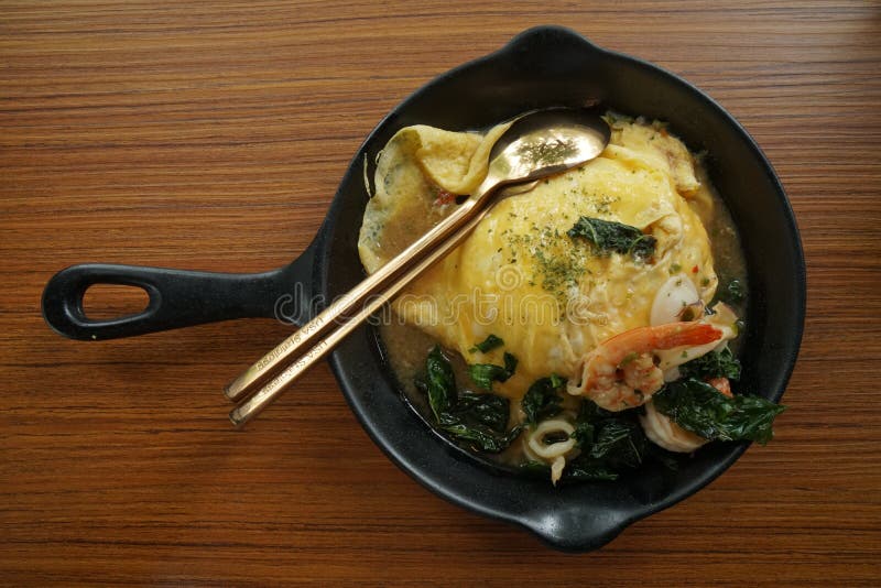 Rice Topped with Stirfried Pork and Basil with Omelette on White Ceramic Plate Stock Image