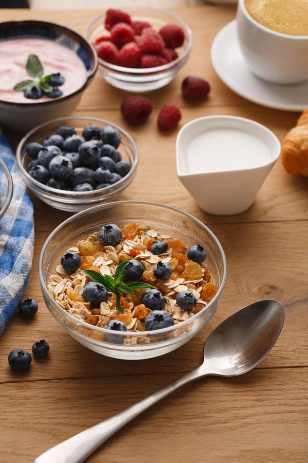 Rich breakfast on natural wooden table