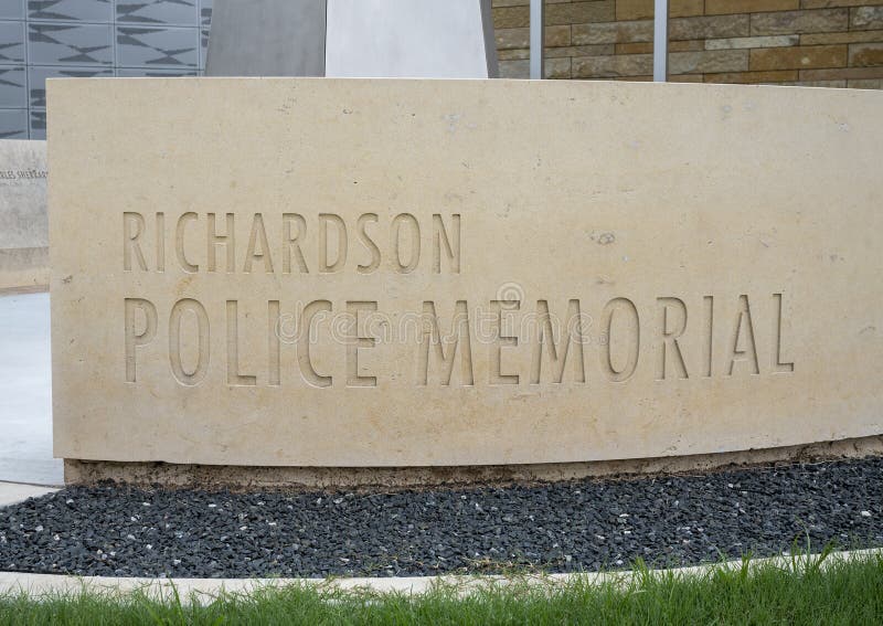 Pictured is the title inscription for the police memorial that features a sculpture titled `Radiant Shield` by Shane Allbirtton and Norman Lee at the police station in the City of Richardson, Texas.  It is part of a police memorial, it`s surrounding low limestone wall being engraved on the inside with a quote, a poem, a reference to a fallen officer, and a dedication to the officers of the Richardson Police Department who have given their lives while serving and protecting the citizens. Pictured is the title inscription for the police memorial that features a sculpture titled `Radiant Shield` by Shane Allbirtton and Norman Lee at the police station in the City of Richardson, Texas.  It is part of a police memorial, it`s surrounding low limestone wall being engraved on the inside with a quote, a poem, a reference to a fallen officer, and a dedication to the officers of the Richardson Police Department who have given their lives while serving and protecting the citizens.