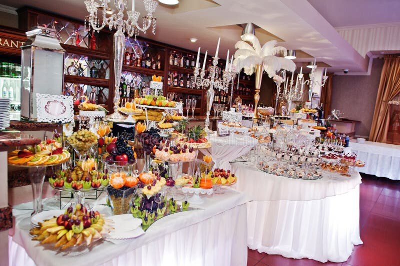 Richest Wedding Reception of Different Sweets, Fruits and Drinks Stock