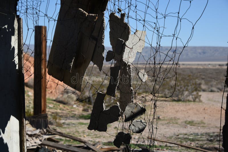 Hanging crushed cement makes a barrier curtain in a razed house. Hanging crushed cement makes a barrier curtain in a razed house