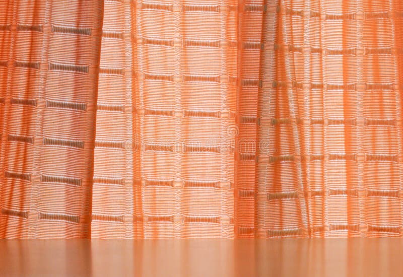 Orange curtain on the window of living room. Orange curtain on the window of living room