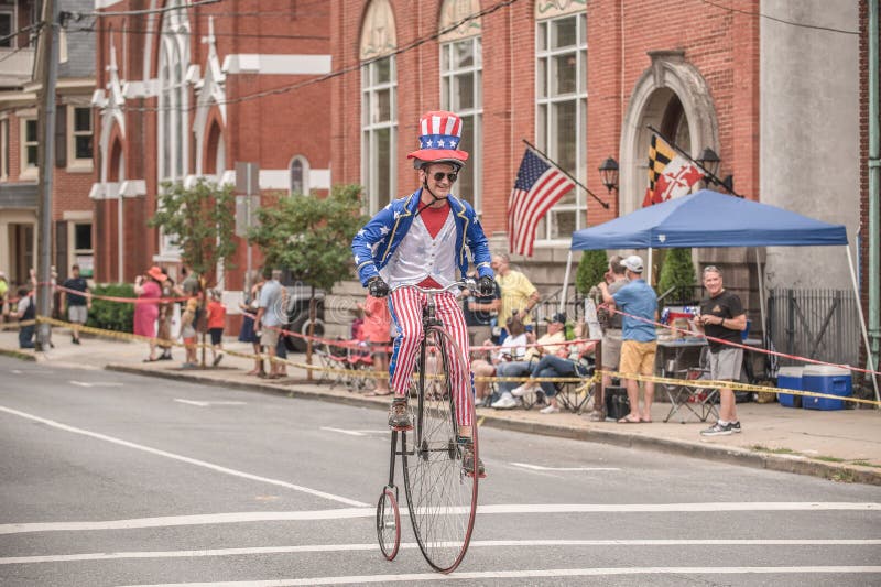 Rider Racing on His Penny-farthing Bicycle Downtown - the Clustered ...