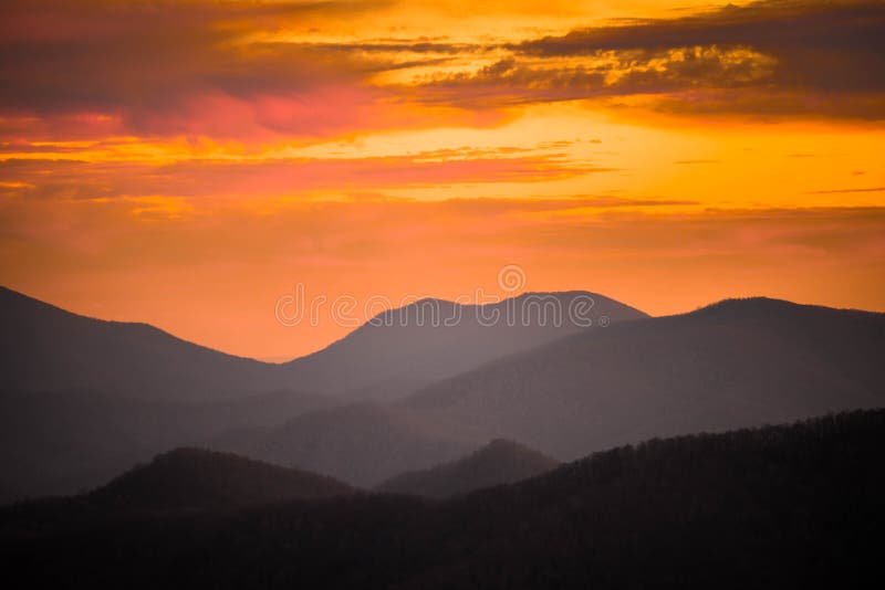 An incredible and colorful sunset at the top of Wayah Bald in the Blue Ridge Mountains. Located in the Nantahala National forest near Franklin, North Carolina. An incredible and colorful sunset at the top of Wayah Bald in the Blue Ridge Mountains. Located in the Nantahala National forest near Franklin, North Carolina