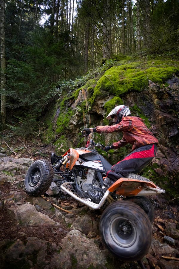 Riding ATV in mountains stock photo. Image of quadbike - 13064540
