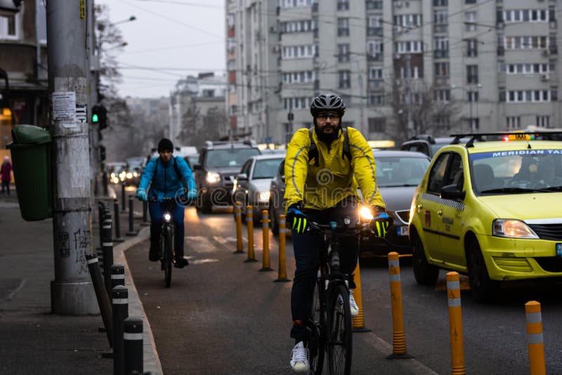 Riding a Bicycle on the City Streets. Commute To Work in Bucharest