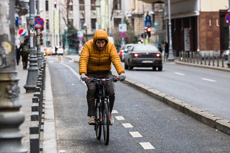 Riding a Bicycle on the City Streets. Commute To Work in Bucharest