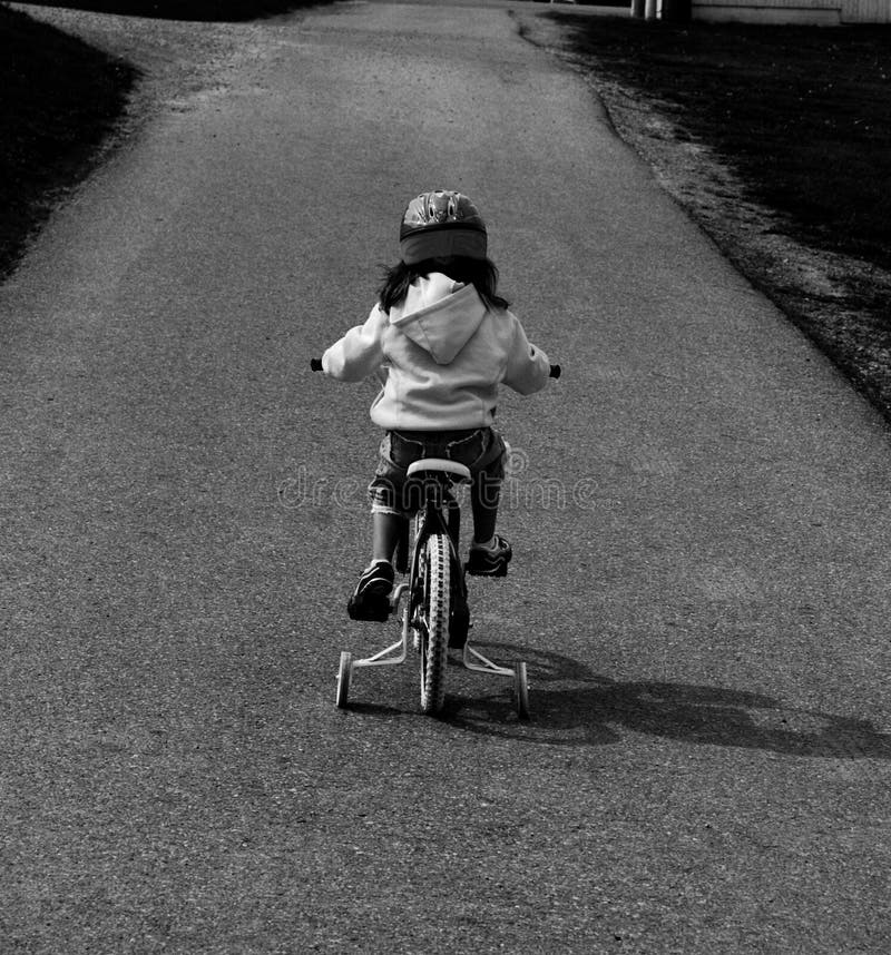 Learning To Ride a Bike with Training Wheels Stock Image Image of