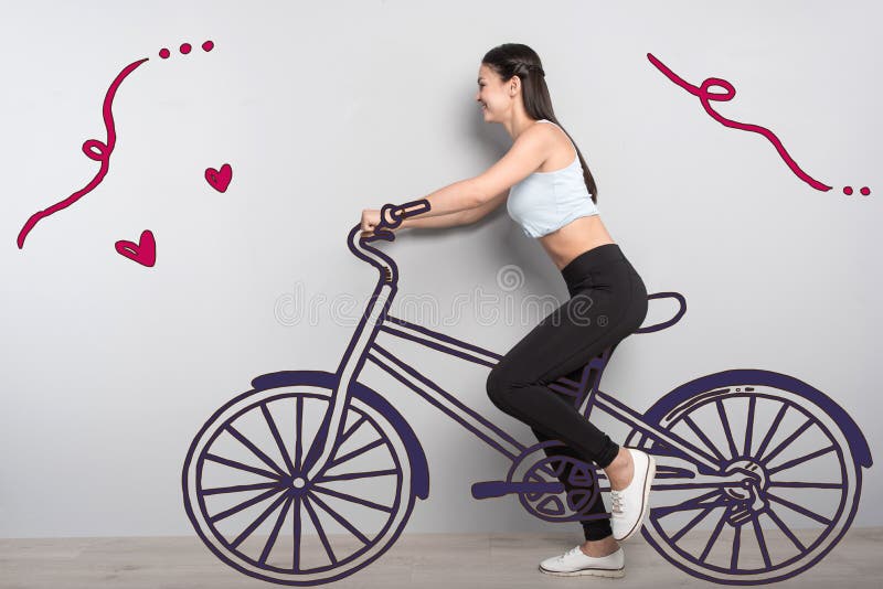 Emotional student riding a bike and feeling happy stock image Emotional student riding a bike and feeling happy stock image