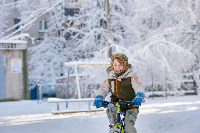 Riding bike on snow stock photo. Image of bike, bicycle 129517568