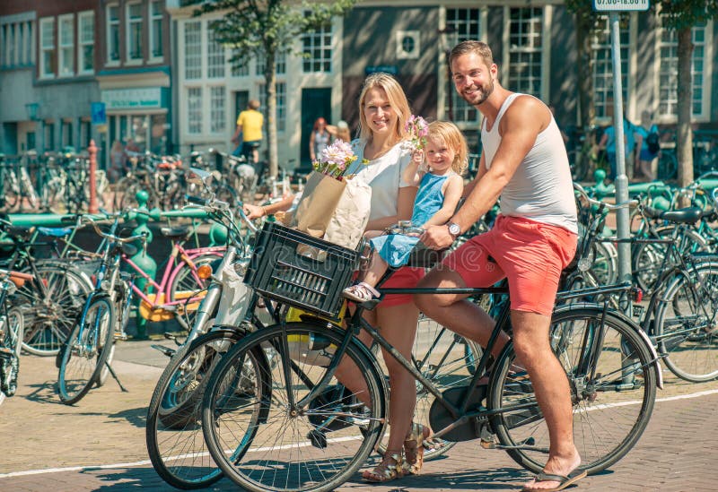 Riding a bike in Amsterdam stock image. Image of rusty 33153395