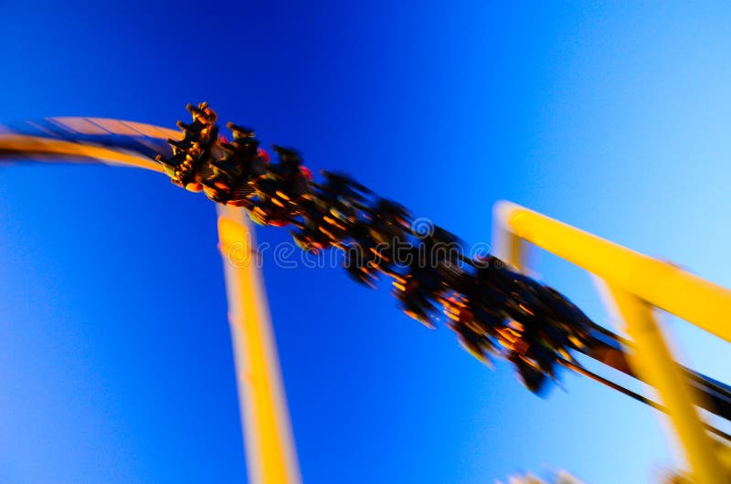 Amusement park roller coaster riding for family ans school children vacation holiday. Amusement park roller coaster riding for family ans school children vacation holiday