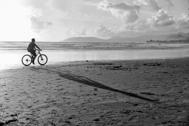 Bike riding on the beach stock image. Image of beach 25540743