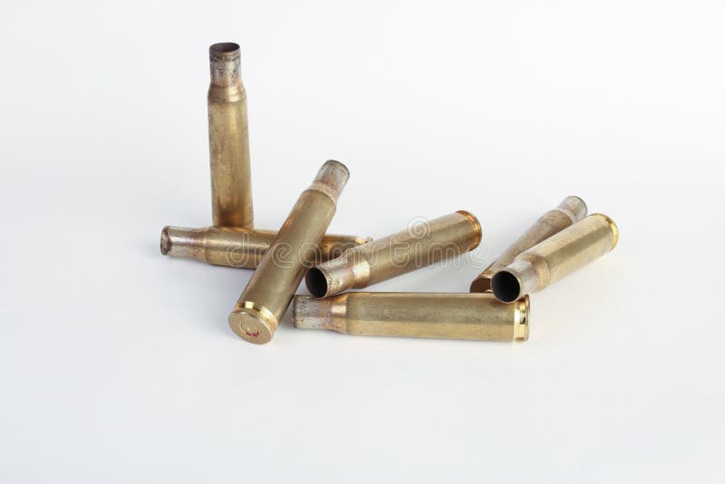 Rifle bullet shell casings on white background