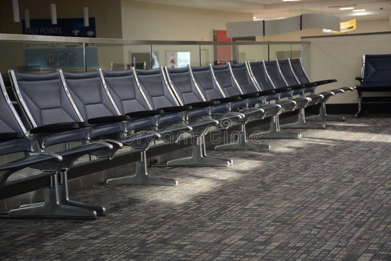 Chairs in a line at a gate in the airport at Columbus, ohio. Chairs in a line at a gate in the airport at Columbus, ohio