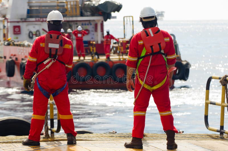 Rig workers being transported to offshore rigs by boat