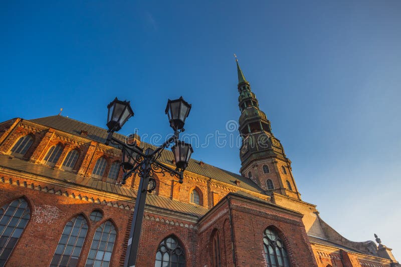 Riga St. Peter&#x27;s Church - the tallest peak in Riga, is one the oldest and most valuable monuments of medieval stock photos