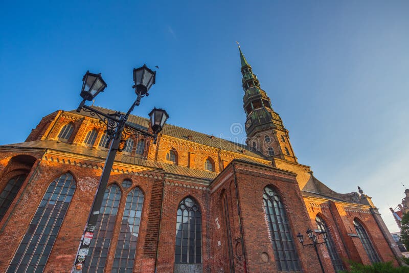 Riga St. Peter&#x27;s Church - the tallest peak in Riga, is one the oldest and most valuable monuments of medieval royalty free stock photo