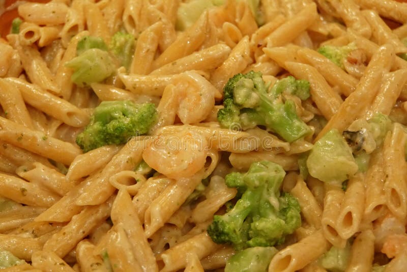 Rigatoni Alfredo Pasta With Pesto, Shrimp And Broccoli Stock Photo