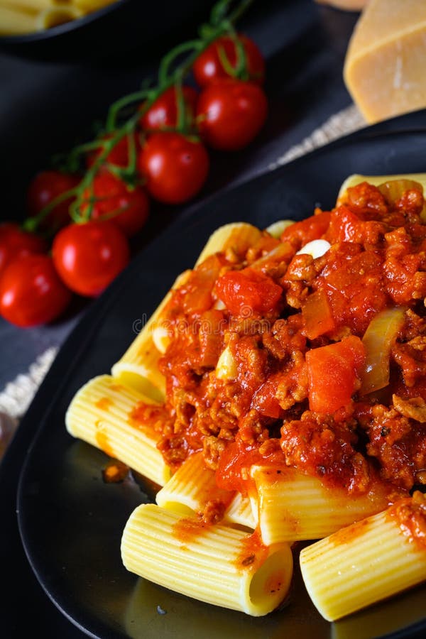 A Rigatoni Pasta with Bolognese Sauce and Fresh Basil Stock Photo Image of food, leaf 172343760
