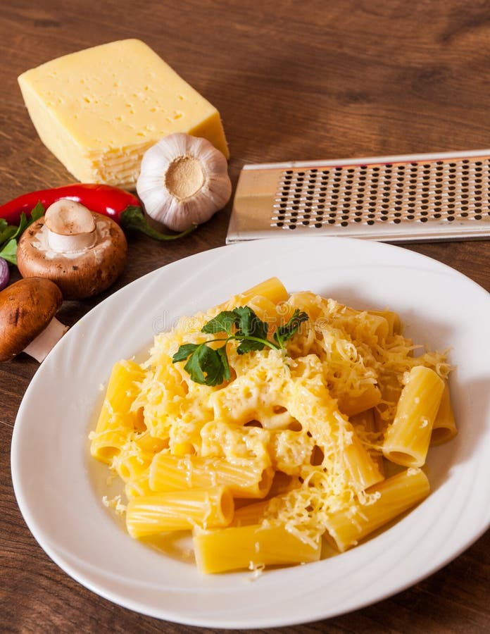 Buttered Penne Rigate Noodles with Parmesan Cheese Stock Photo Image