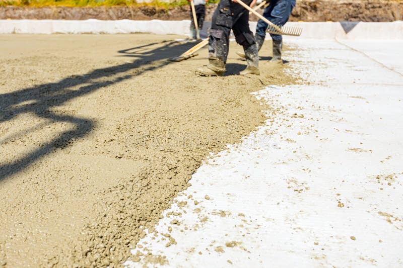 Riggers, Workers Use Rake and Handmade Wooden Tool To Level Fresh