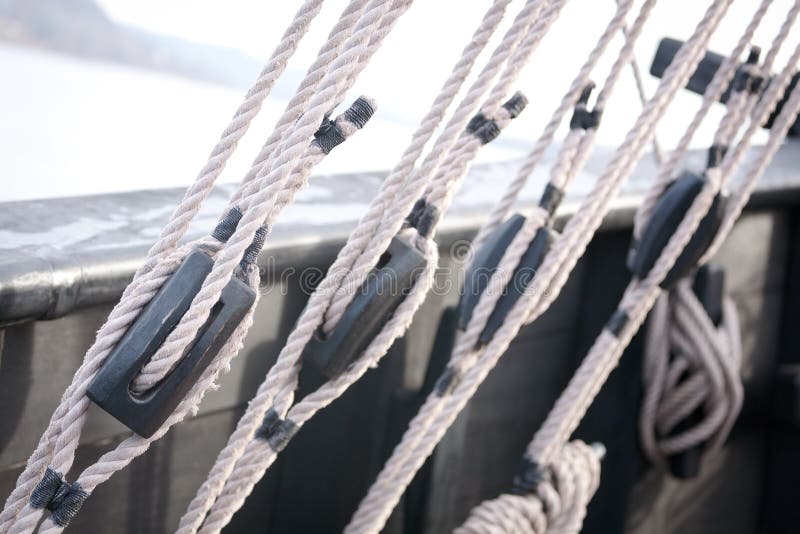 Wooden blocks, pulleys and ropes on an old wooden sail boat. Wooden blocks, pulleys and ropes on an old wooden sail boat.