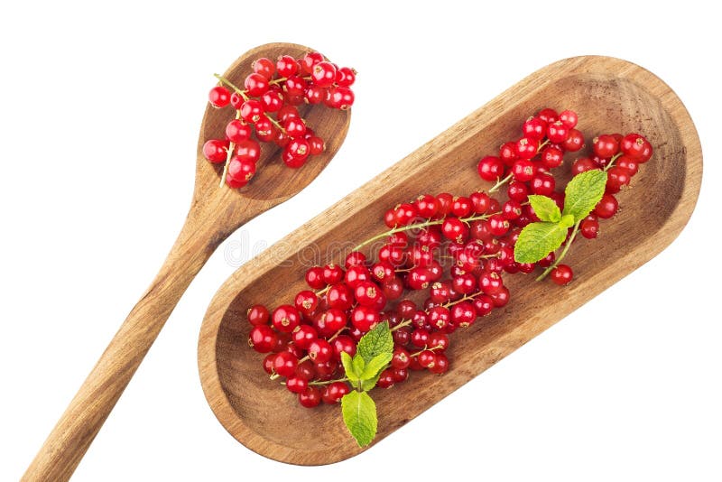 Rijpe redcurrants op houten plaat met lepel op een witte backgroun royalty-vrije stock foto Rijpe redcurrants op houten plaat met lepel op een witte backgroun royalty-vrije stock foto