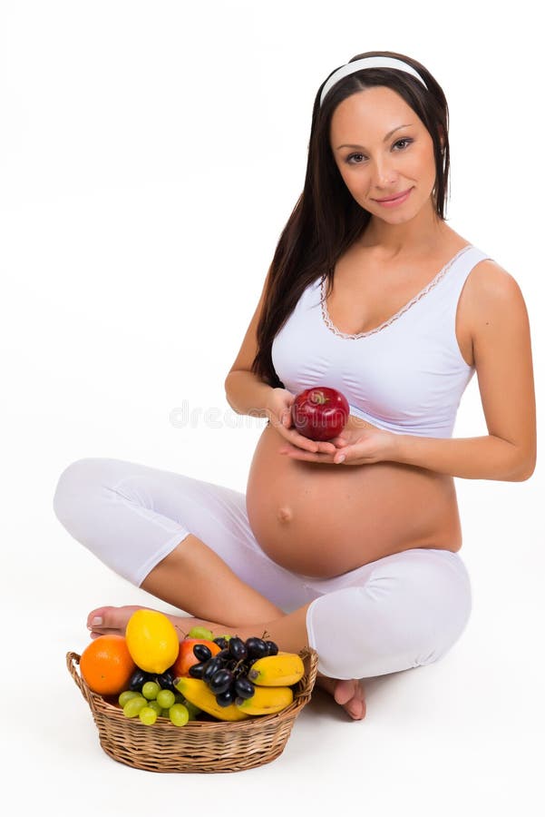Riktig näring under havandeskap Vitaminer och frukt royaltyfri fotografi Riktig näring under havandeskap Vitaminer och frukt royaltyfri fotografi