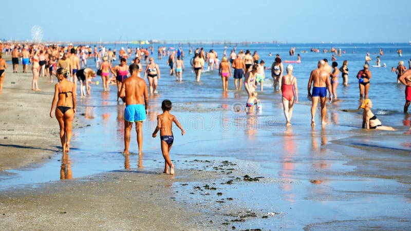 Rimini, Italy - August 2019: people having fun at beach at summer