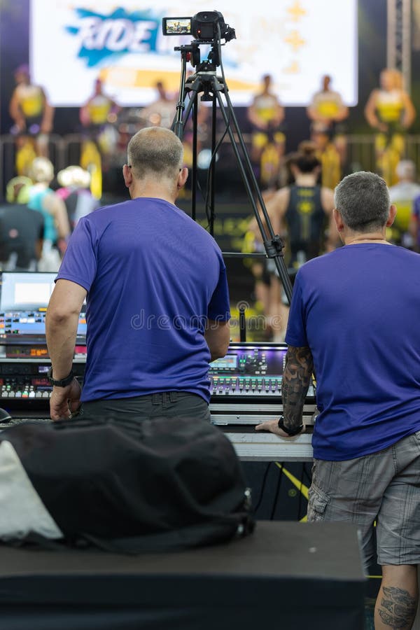 Lighting and Sound Technician and Broadcast Operator at Work in the