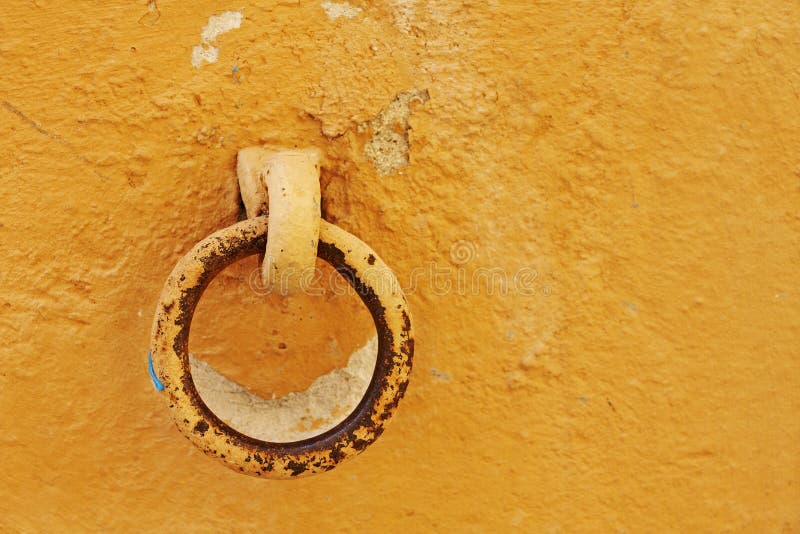 Ring bolt in a weathered orange wall