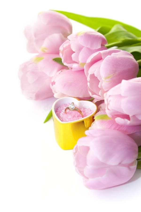 Ring and tulips isolated on white