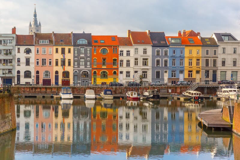 Embankment of the river Leie with reflections colored houses and Belfry tower in Ghent town, Belgium. Embankment of the river Leie with reflections colored houses and Belfry tower in Ghent town, Belgium