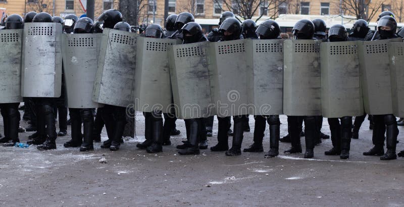 Riot Police Force with Shields in Row on City Street Editorial ...