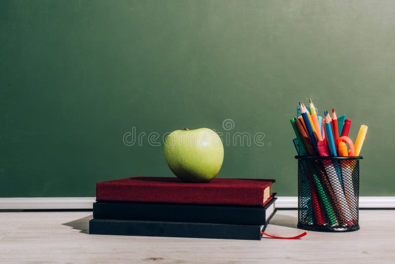 Red apple on books stock photo. Image of medium, fruit - 11147656