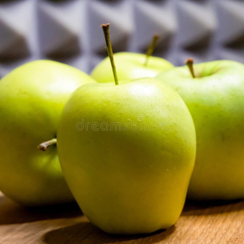 Ripe apples on wood, grey background, natural theme royalty free stock photo