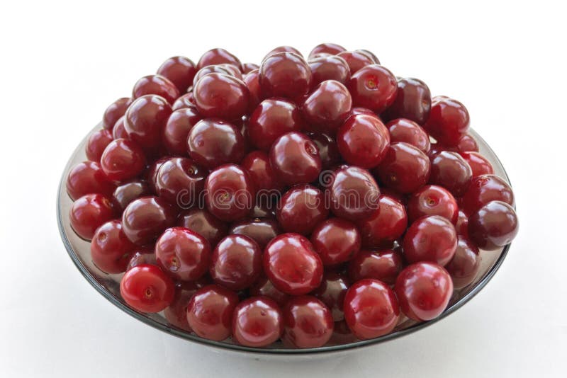 Ripe cherries on a glass dish