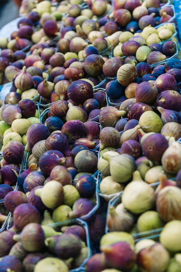Ripe figs in boxes for sale in the market stock photos