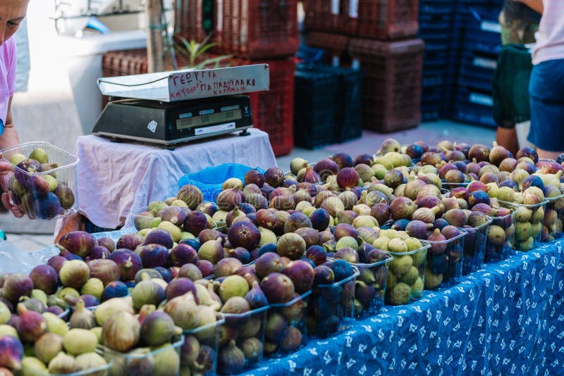 Ripe figs in boxes for sale in the market stock photo